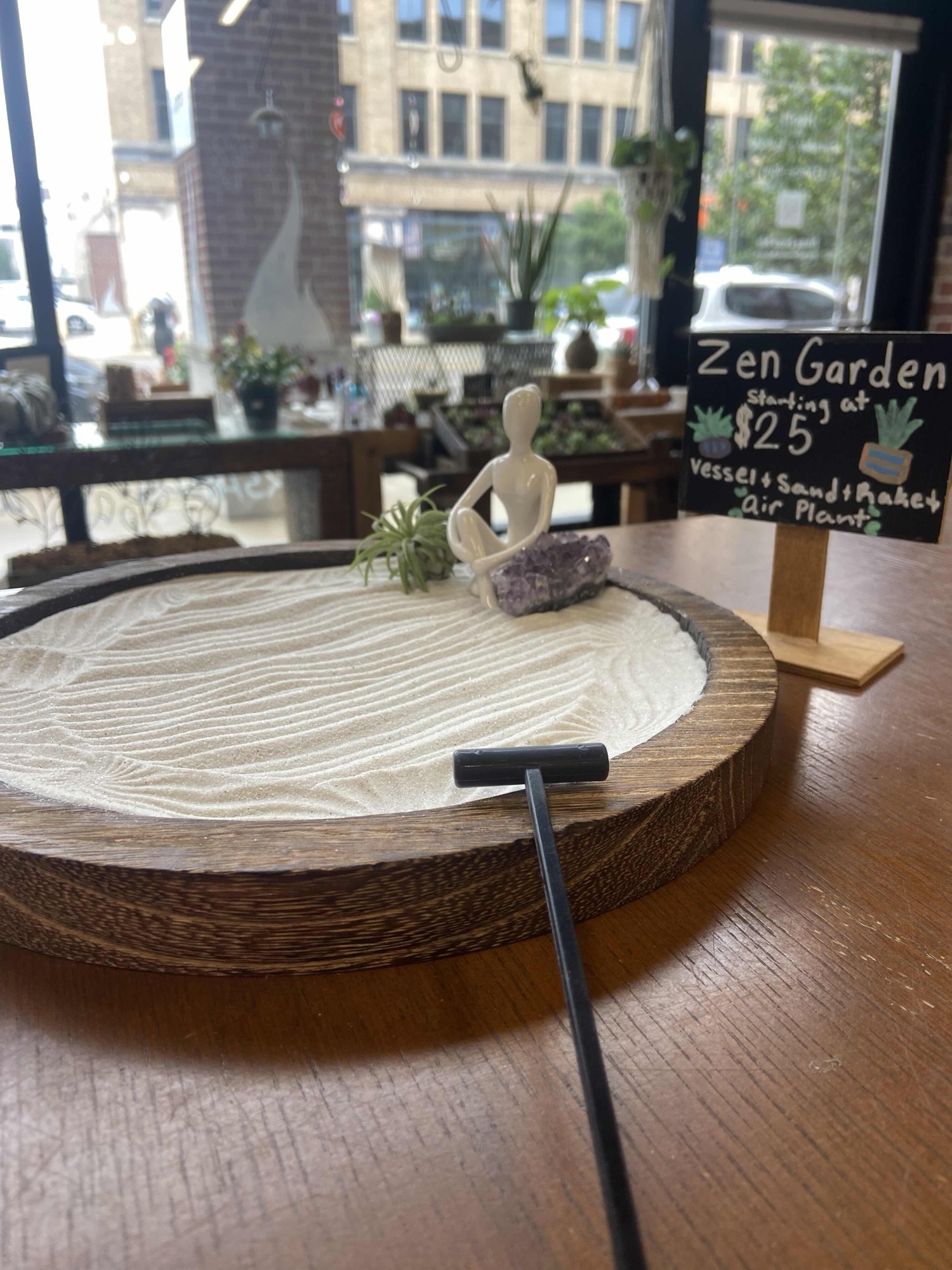 A zen garden arrangement in a shallow dish